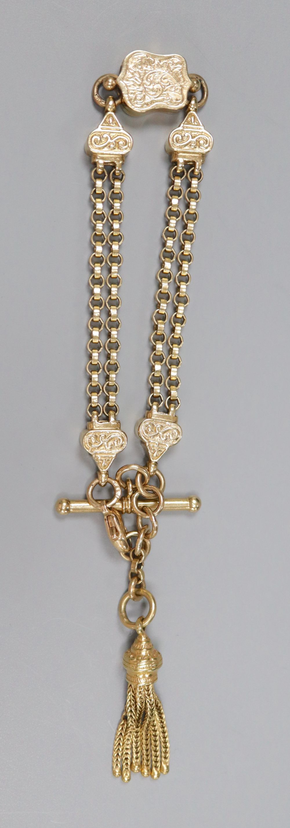 A 9ct gold double chain bracelet with engraved shaped box links, tassel suspension and bolt and ring clasp, 16.3cm, 20.4g.
